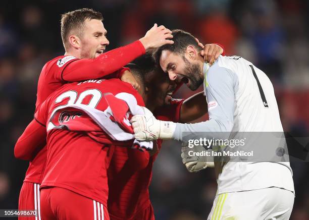 Joe Lewis, Max Lowe and Shay Logan of Aberdeen reacts at full time during the Betfred Scottish League Cup Semi Final match between Aberdeen and...