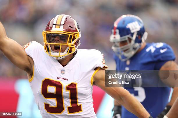 Ryan Kerrigan of the Washington Redskins reacts after sacking Eli Manning of the New York Giants during the third quarter at MetLife Stadium on...