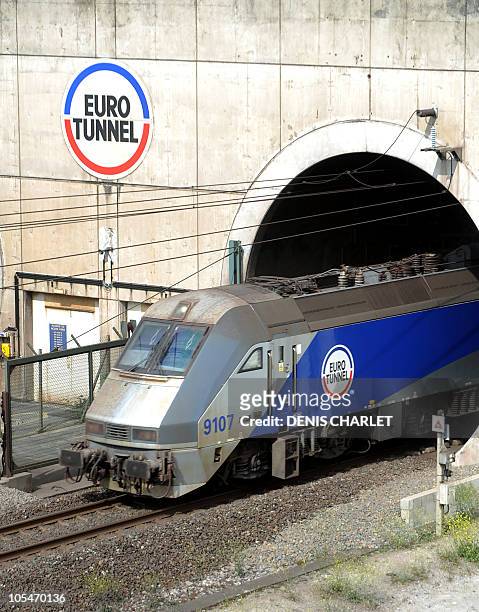 An Eurotunnel shuttle transporting cars from London leaves the Channel tunnel, before arriving at the Eurotunnel terminal in Coquelles, near Calais,...