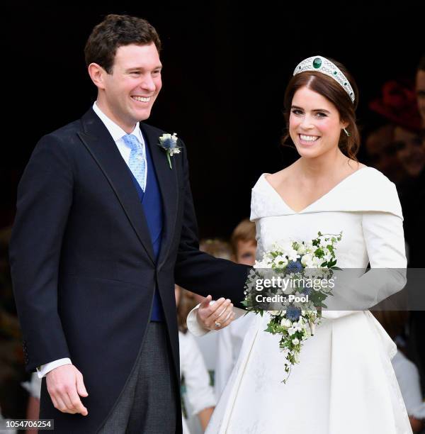 Jack Brooksbank and Princess Eugenie leave St George's Chapel after their wedding ceremony on October 12, 2018 in Windsor, England.