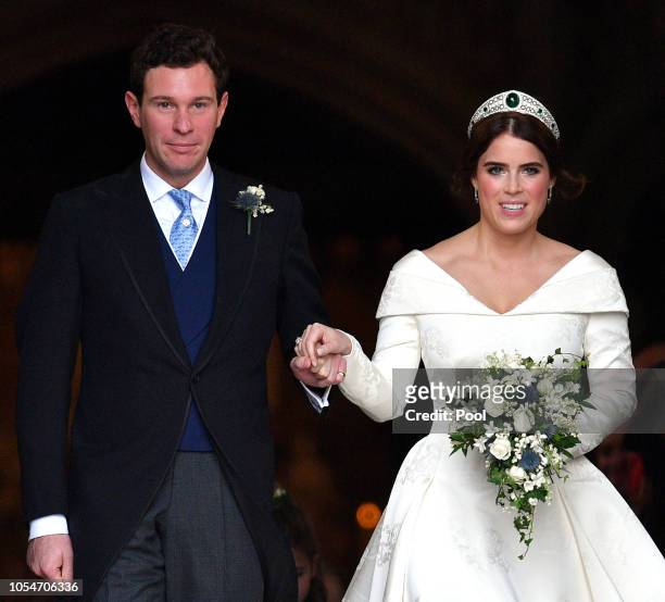 Jack Brooksbank and Princess Eugenie leave St George's Chapel after their wedding ceremony on October 12, 2018 in Windsor, England.