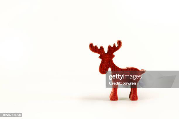red christmas elk isolated on white background - white moose stock pictures, royalty-free photos & images