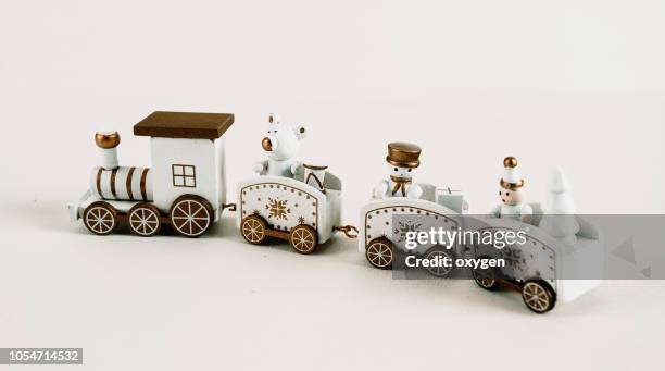 toy train on white background for christmas - wagon photos et images de collection