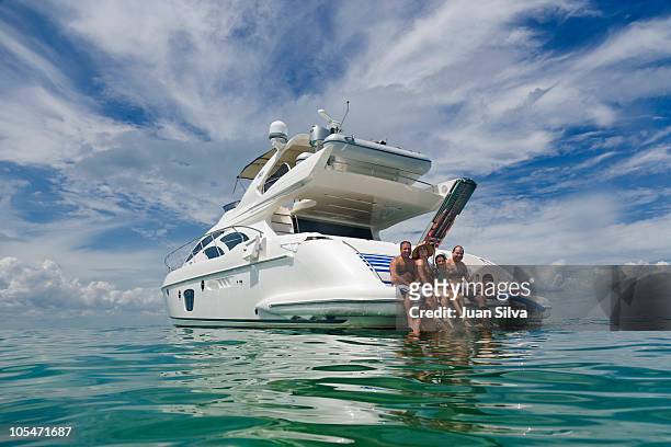 group of people on boat, smiling, portrait - family yacht stock pictures, royalty-free photos & images