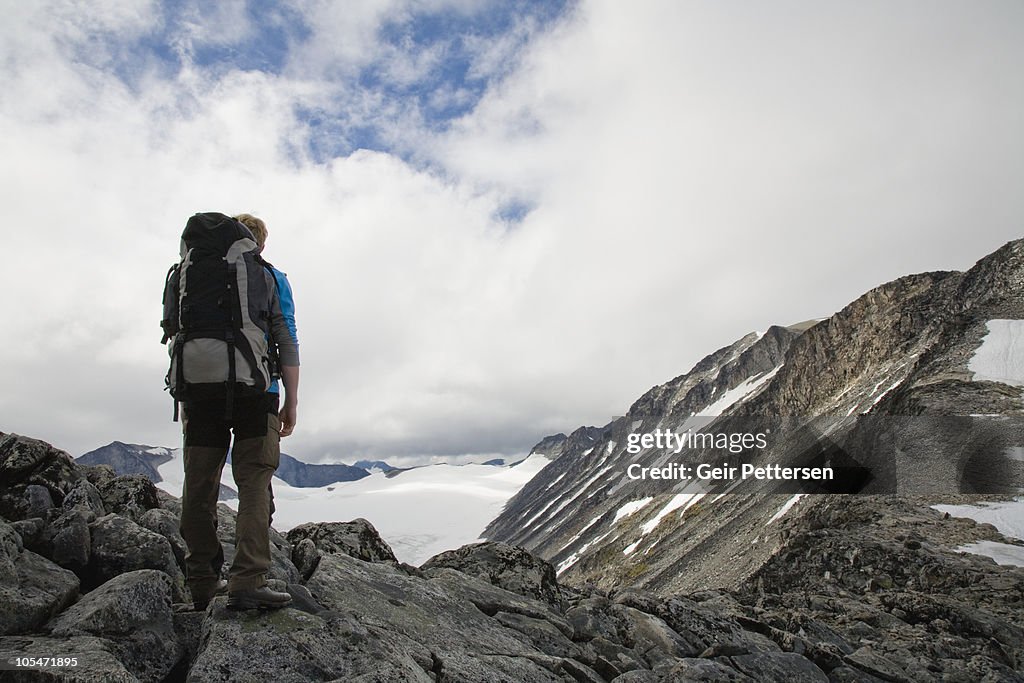 Hiker overlooking mountain scenery