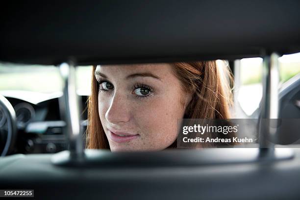 teenage girl sitting in passenger seat, close up. - ot ストックフォトと画像