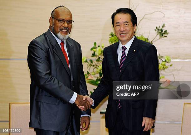 Prime Minister of Vanuatu and Chairman of the Pacific Islands Forum Edward Natapei shakes hands with Japanese Prime Minister Naoto Kan at the prime...