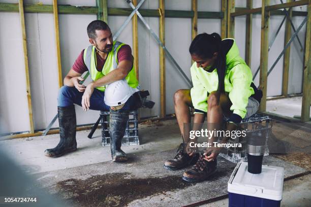 construction industry coffee break. - builders boots stock pictures, royalty-free photos & images