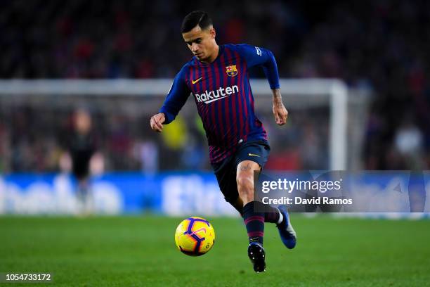 Philippe Coutinho of FC Barcelona runs with the ball during the La Liga match between FC Barcelona and Real Madrid CF at Camp Nou on October 28, 2018...