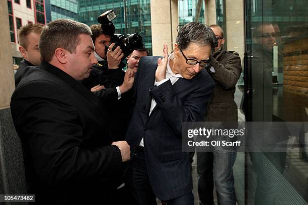 John W. Henry , the owner of New England Sports Ventures, arrives at the offices of the law firm Slaughter and May on October 15, 2010 in London,...