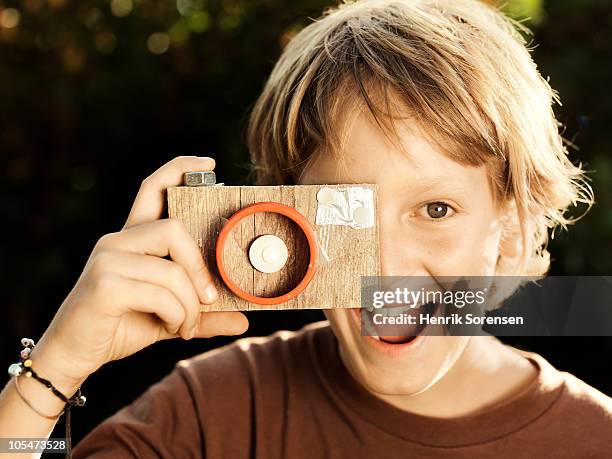child taking picture with homemade camera - toy camera stock pictures, royalty-free photos & images