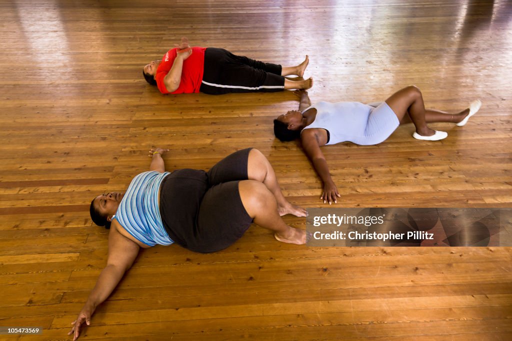 Overweight women exercising before dance rehearsal