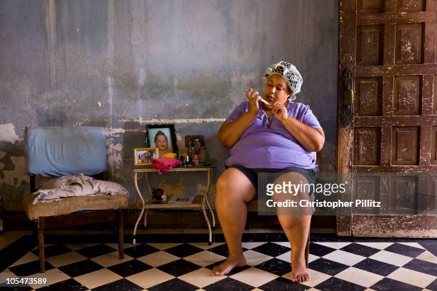 Dancer Maylin Daza at home grooming her nails, Havana, Cuba.