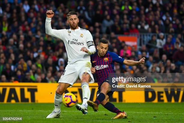 Jordi Alba of FC Barcelona competes for the ball with Sergio Ramos of Real Madrid CF during the La Liga match between FC Barcelona and Real Madrid CF...
