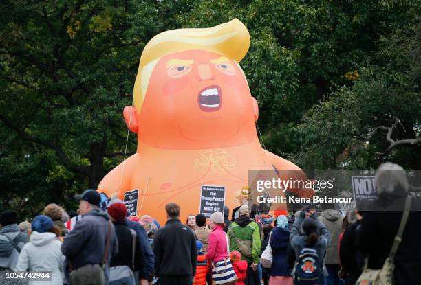 The Baby Trump Balloon rises after being inflated in Battery Park as part of an "Impeachment Parade" protest on October 28, 2018 in New York City....