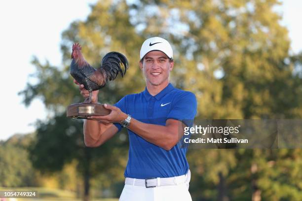 Cameron Champ poses with the trophy after winning the Sanderson Farms Championship at the Country Club of Jackson on October 28, 2018 in Jackson,...