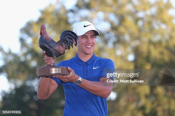 Cameron Champ poses with the trophy after winning the Sanderson Farms Championship at the Country Club of Jackson on October 28, 2018 in Jackson,...