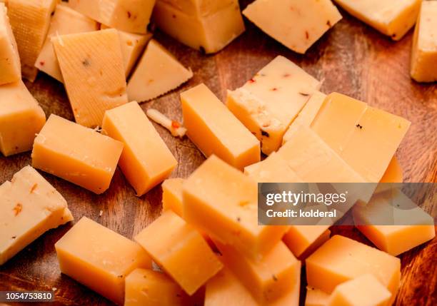 yellow mature dutch cheese - cheese cubes stock pictures, royalty-free photos & images