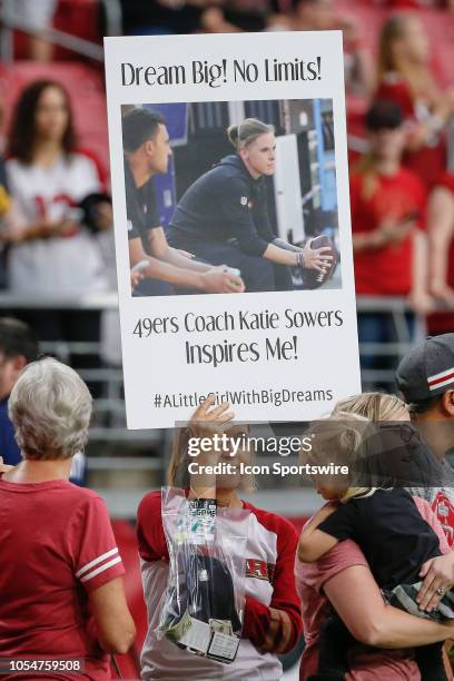 Fan holds up a sign praising 49ers coach Katie Sowers before the NFL football game between the San Francisco 49ers and the Arizona Cardinals on...