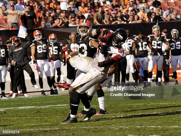 Linebacker Stephen Nicholas of the Atlanta Falcons intercepts a pass intended for wide receiver Chansi Stuckey of the Cleveland Browns on during a...