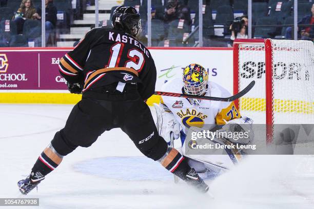 Mark Kastelic of the Calgary Hitmen takes a shot on Nolan Maier of the Saskatoon Blades during a WHL game at the Scotiabank Saddledome on October 28,...