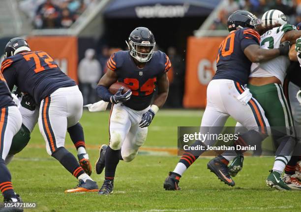 Jordan Howard of the Chicago Bears breaks a 24 yard first down run against the New York Jets at Soldier Field on October 28, 2018 in Chicago,...