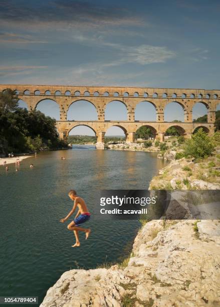 france. the pont du gard aqueduct. - pont du gard aqueduct stock pictures, royalty-free photos & images