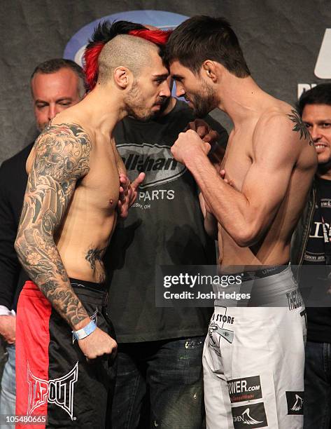 Welterweight opponents Dan Hardy and Carlos Condit face off at the UFC 120 weigh-in at Earl's Court Arena on October 2010 in London, England.