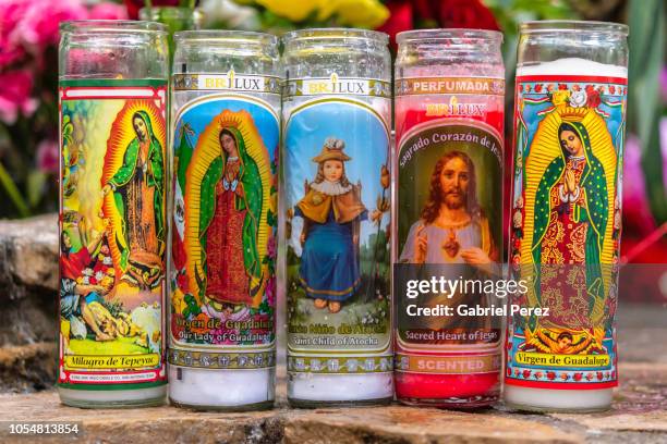 a catholic offering - prayer candle stock pictures, royalty-free photos & images