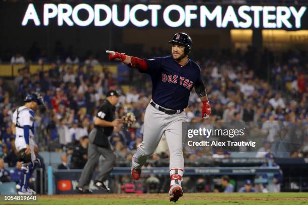 Steve Pearce of the Boston Red Sox rounds the bases on a solo home run in the eighth inning during Game 5 of the 2018 World Series against the Los...