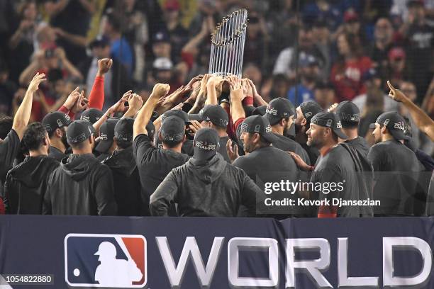 The Boston Red Sox celebrate with the World Series trophy after their 5-1 win over the Los Angeles Dodgers in Game Five to win the 2018 World Series...