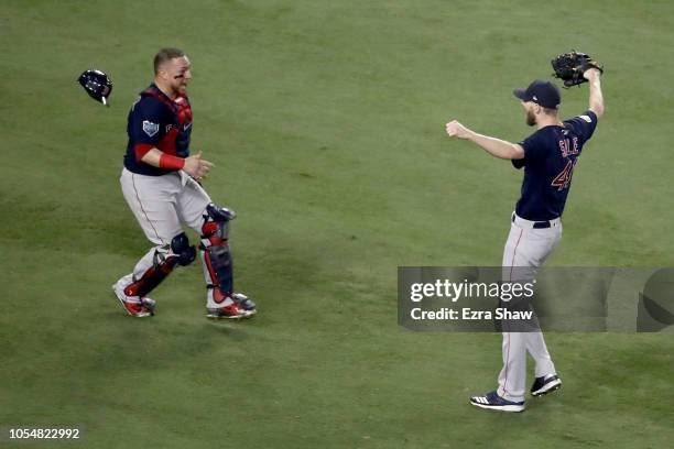 Christian Vazquez jumps into the arms of Chris Sale of the Boston Red Sox to celebrate their 5-1 win over the Los Angeles Dodgers in Game Five to win...