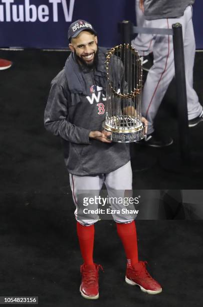David Price of the Boston Red Sox celebrates with the World Series trophy after his team's 5-1 win over the Los Angeles Dodgers in Game Five to win...