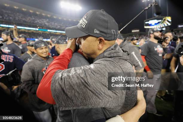 Manager Alex Cora and David Price of the Boston Red Sox celebrate their teams 5-1 win over the Los Angeles Dodgers in Game Five of the 2018 World...