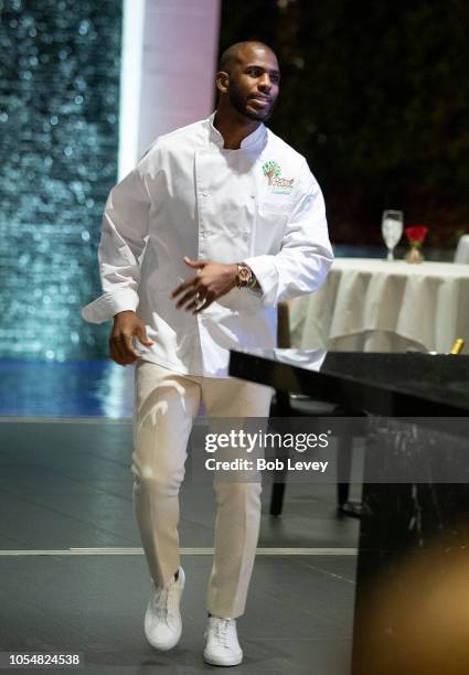 Chris Paul of the Houston Rockets prepares to serve guests at the Chris Paul Family Foundation's "Celebrity Server" Fundraiser at Mastro's Steakhouse...