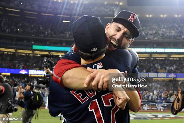 Matt Barnes and Nathan Eovaldi of the Boston Red Sox celebrate their teams 5-1 win over the Los Angeles Dodgers in Game Five of the 2018 World Series...