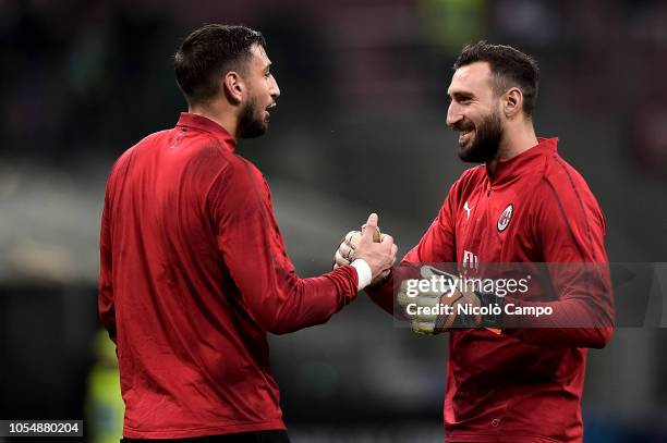 Gianluigi Donnarumma of AC Milan shakes hands with Antonio Donnarumma prior to the Serie A football match between AC Milan and UC Sampdoria. AC Milan...