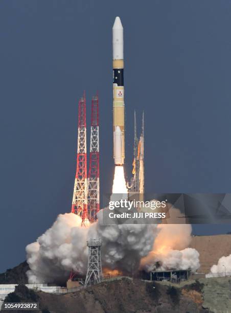 Rocket lifts off from its launching pod of Tanegashima Space Centre on October 29, 2018 as it carries an Ibuki-2 greenhouse gases observing satellite...