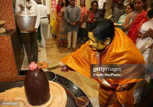 Her Holiness Amma Sri Karunamayi performs prayers honouring Lord Shiva at the Hindu Heritage Centre in Mississauga, Ontario, Canada, on June 18,...