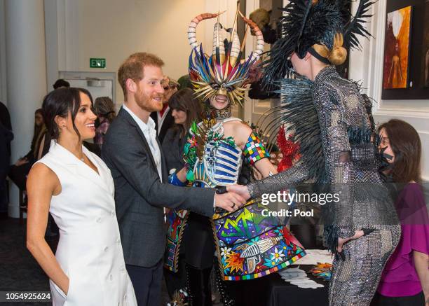 Prince Harry, Duke of Sussex and Meghan, Duchess of Sussex meet models wearing the work of industry leading artists in film, sculpture and costume...