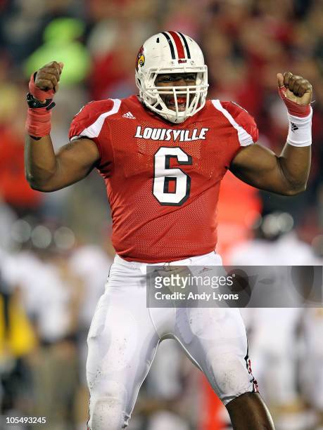 Greg Scruggs of the Louisville Cardinals celebrates after intercepting a pass during the Big East Conference game against the Cincinnati Bearcats at...