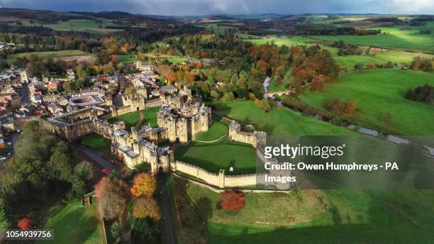 An aerial view of a Alnwick Castle, Northumberland, surrounded by autumn colours.
