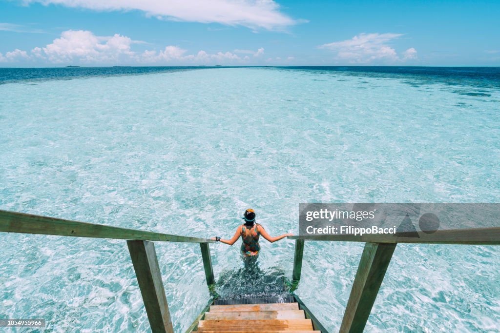 Young adult woman moving down to the sea