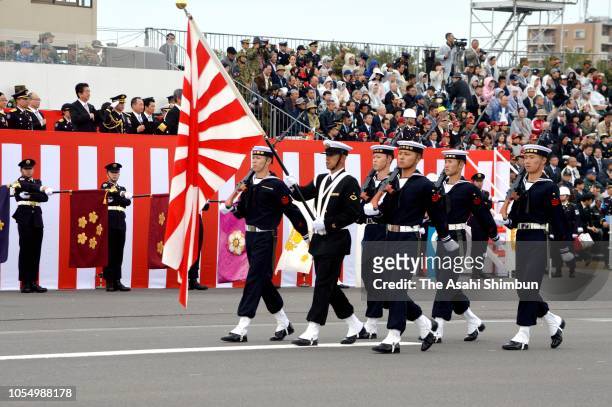 Japanese Prime Minister Shinzo Abe reviews during the Japan's Ground Self-Defense Force annual review at the Japan Ground Self Defense Force Camp...