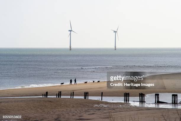 Wind Turbines, Blyth Offshore Wind Farm, Northumberland, 2010. View across the beach towards two wind turbines that are part of the wind farm. Artist...