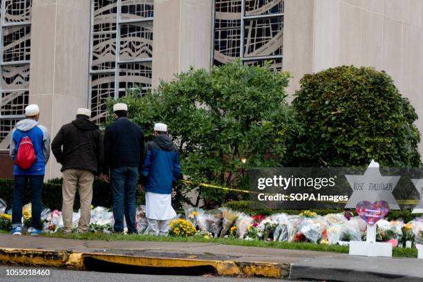Muslim mourners seen in front of the makeshift memorial at the site of the mass shooting. After the tragic shooting in Pittsburgh, PA at the Tree of...