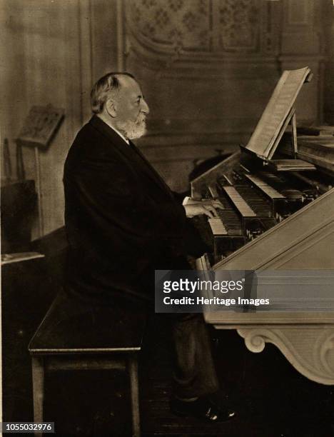 Camille Saint-Saëns at the Organ, 1913. Private Collection. Artist Anonymous.
