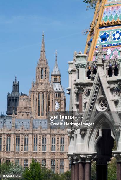 Victoria Tower Gardens, with the Victoria Tower, Elizabeth Tower, spires and Big Ben, part of the Houses of Parliament, and the Buxton Memorial...