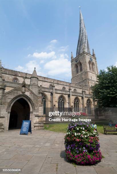 The Crooked Spire of St Mary and All Saints Church, built in the 13th century and allegedly twisted because of the lack of skilled craftsmen due to...