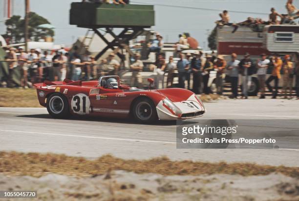 View of the Autodelta SpA Alfa Romeo T33/3 Alfa Romeo 3L V8 racing car driven by Piers Courage and Andrea de Adamich to finish in 8th place during...